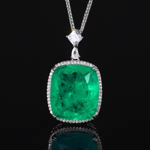 Exquisite cushion cut green gemstone pendant necklace with dazzling halo zirconia details.