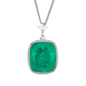 Green gemstone halo pendant necklace detail, featuring sparkling zirconia stones.