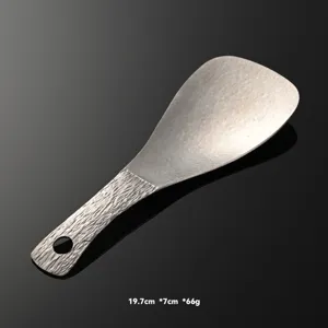 Pure titanium square rice spoon with textured handle and hanging hole for kitchen use.
