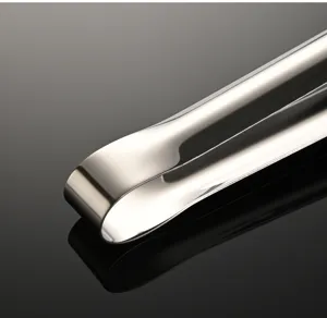Stainless steel ice tong detail, polished mirror finish wide food clip for kitchen bar.