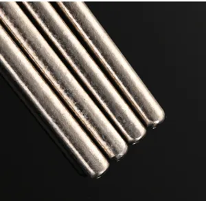 Close-up detail view of pure titanium metal frying chopsticks, durable kitchen utensil.