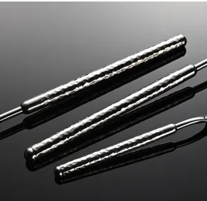 Detailed closeup of stainless steel tableware featuring a luxurious hammered handle finish.