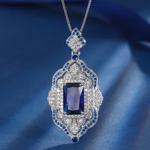 Vintage royal palace style blue crystal pendant necklace with sparkling zirconia details for women.