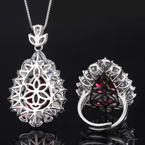 Detailed close-up view of the exquisite pear-shaped red gemstone necklace and ring set.
