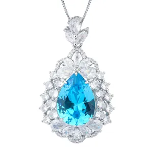 Close-up of a stunning blue teardrop crystal gemstone pendant necklace with white zirconias.