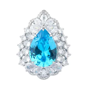 Detailed view of luxury pear-shaped blue gemstone pendant with sparkling white cubic zirconia.