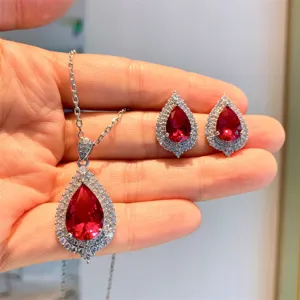 Stunning pear-cut synthetic ruby pendant necklace and matching earrings jewelry set sparkle.