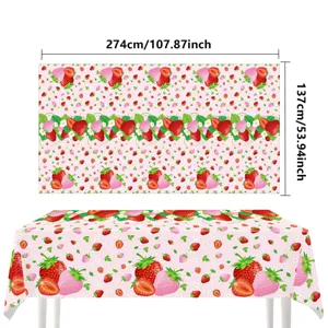 Strawberry patterned tablecloth detail showing vibrant pink print and clear texture.