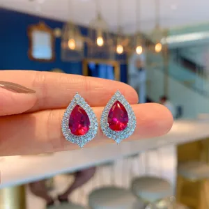 Exquisite pear cut red crystal halo drop earrings with sparkling cubic zirconia for women.