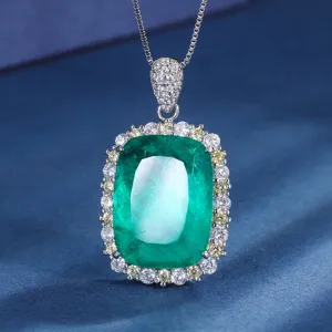 Luxury cushion cut green gemstone pendant necklace with dazzling cubic zirconia halo.
