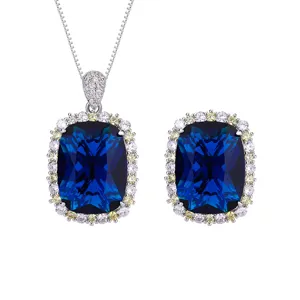 Luxury blue gemstone necklace earrings set with sparkling cubic zirconia halo for women.