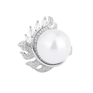 Korean style elegant pearl silver ring with sparkling cubic zirconia feather design.
