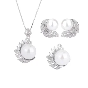 Elegant 3-piece pearl jewelry set featuring feather design with sparkling crystals for women.