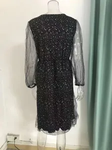 Black V-neck long sleeve dress with sheer mesh spliced design and shimmering glitter details