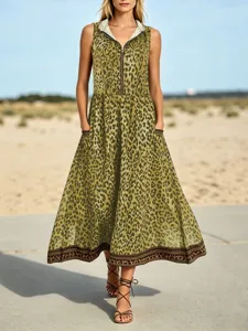 Details of the stylish olive green leopard print sleeveless hooded dress with zip and pockets.