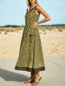 Women's leopard print hooded dress detail with front zipper and pocket for beach wear.