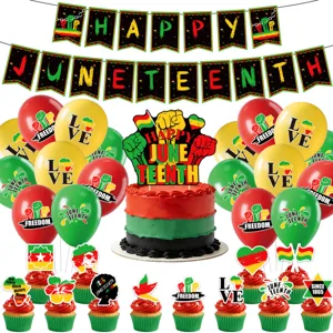 Juneteenth party decoration detail with themed banner, colorful balloons, and cake toppers.