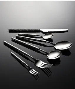 Stainless steel hammered handle cutlery detail shot, exquisite kitchen tableware set design.