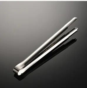 Close-up detail of the stainless steel ice tong featuring a serrated anti-slip grip for food.
