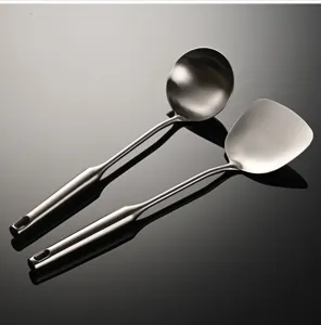 Stainless steel kitchen spatula and soup ladle set with hollow handle, durable cooking tool.