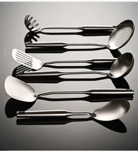 Stainless steel kitchen utensil set, including slotted spoon, ladle, and turner for cooking.