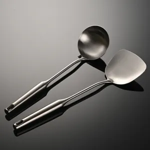 Stainless steel kitchen utensils set, including soup ladle and wok spatula with hollow handle.