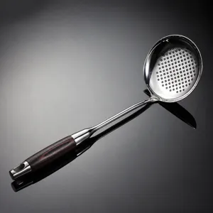 Stainless steel slotted spoon with wood handle kitchen cooking colander ladle tool detail
