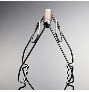 Stainless steel anti-scalding plate retriever detail view with ergonomic wooden handle.