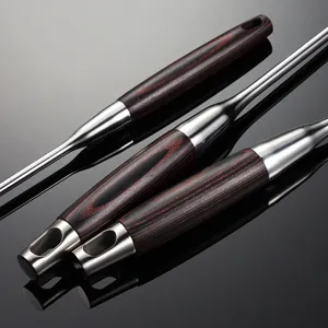 Stainless steel cooking utensil with wood handle and hanging hole main product view