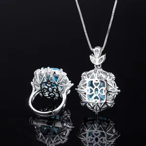Conjunto de collar con colgante de topacio azul y anillo con circonitas brillantes para mujer.