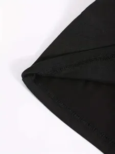 Close up of black solid color apparel garment stitching detail fine needlework texture