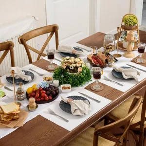 Elegant dining table placemat set with tableware and centerpiece decor for home kitchen.
