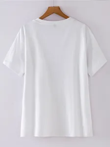 Back view detail of a classic plain white short sleeve t-shirt hanging on wooden hanger.