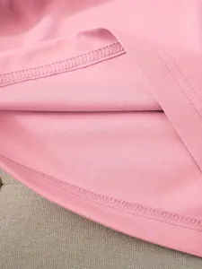 Pink women's short-sleeve crewneck top fabric and fine quality stitching detail.