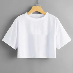 Close-up detail of the plain white crop top t-shirt showing soft fabric and neat collar.
