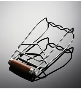 Stainless steel anti-scald plate gripper with wooden handle, perfect for hot bowls and steamer dishes.