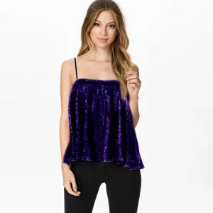 Close-up detail of the purple sequin camisole showing shimmering fabric texture and strappy design.