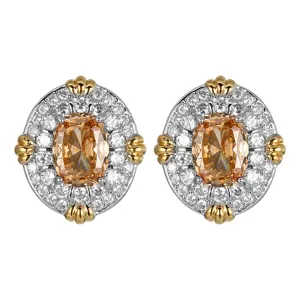 Boucles d'oreilles plaqué or vintage exquises serties de zirconias champagne et blancs scintillants.