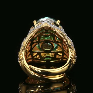 Detailed view of vintage gold plated oval green gemstone ring showing under gallery craft.