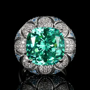 Exquisite vintage cushion-cut green gemstone ring detail with brilliant pavé zircon halo.