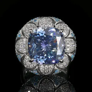 Vintage cushion-cut blue gem statement ring with detailed pavé stones floral cluster detail