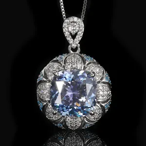 Stunning cushion cut blue stone pendant necklace with intricate pave setting details and delicate chain.