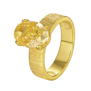 Anillo de latón bañado en oro con gran circonita cúbica ovalada amarilla y banda cepillada.