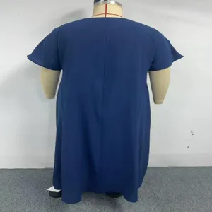 Detailed presentation showcasing the back of solid blue plus size short sleeve long dress.