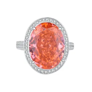 Magnifique bague plaquée or blanc avec grande pierre ovale orange rose et halo de zircons