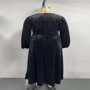 Plus size black velvet long sleeve midi dress with vintage lantern sleeve design for women.