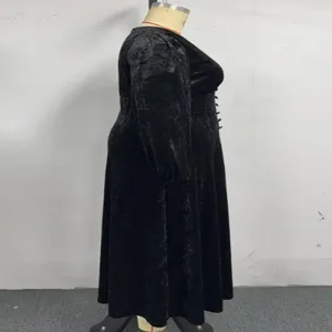 Details of black velvet long sleeve midi dress, vintage style plus size winter dress profile view.