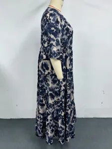 Side detail view of the plus-size floral summer dress, showing the elegant tiered design and comfortable fit.