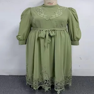 Plus size green long mock neck lace puff sleeve dress detail view showing embroidery