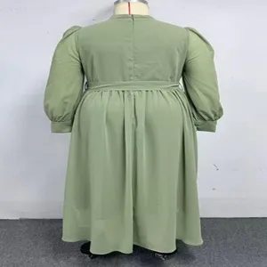 Green plus size long sleeve dress back detail showcasing stand collar and belted waist design.